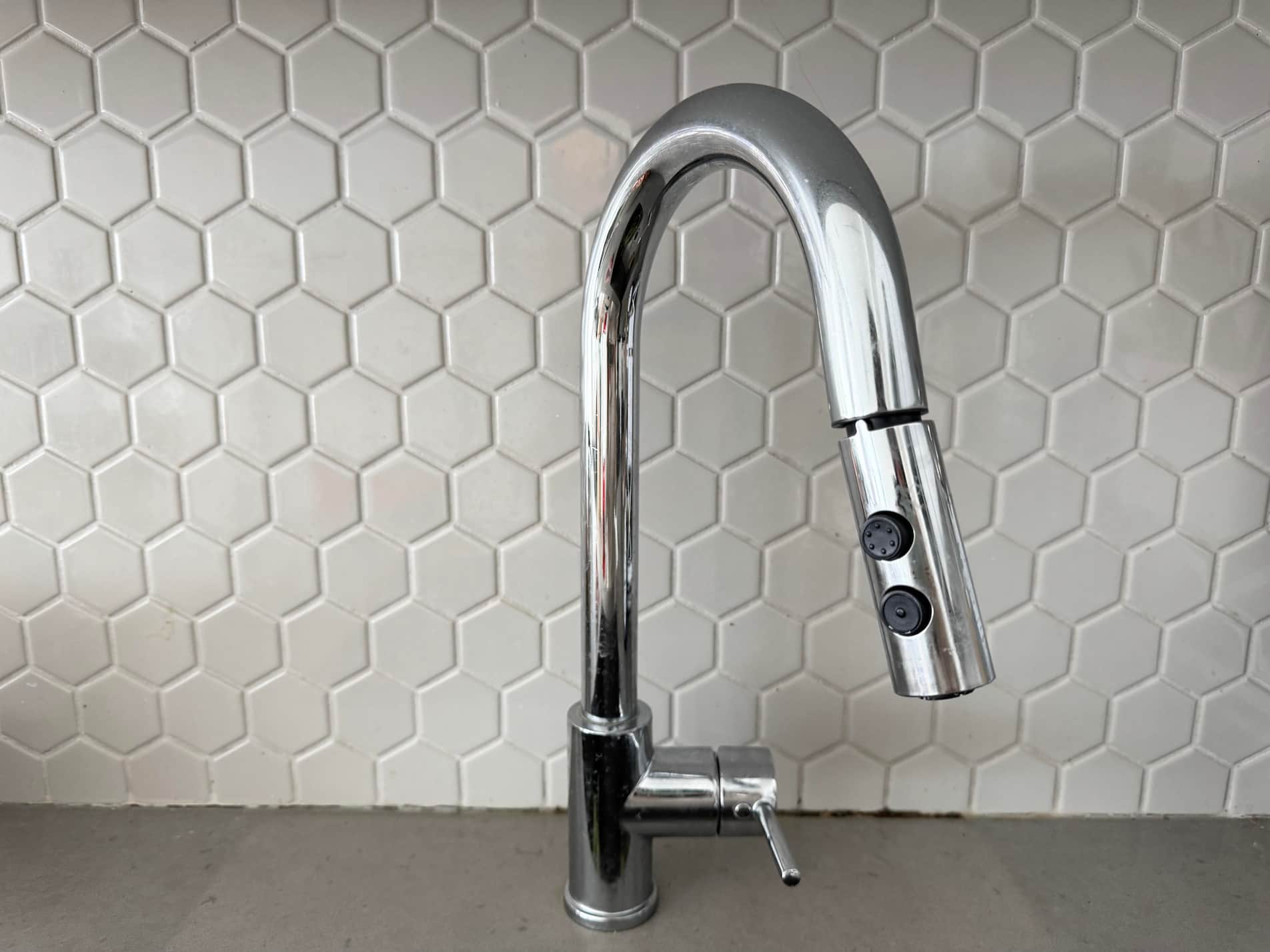 The sound of running water from a faucet