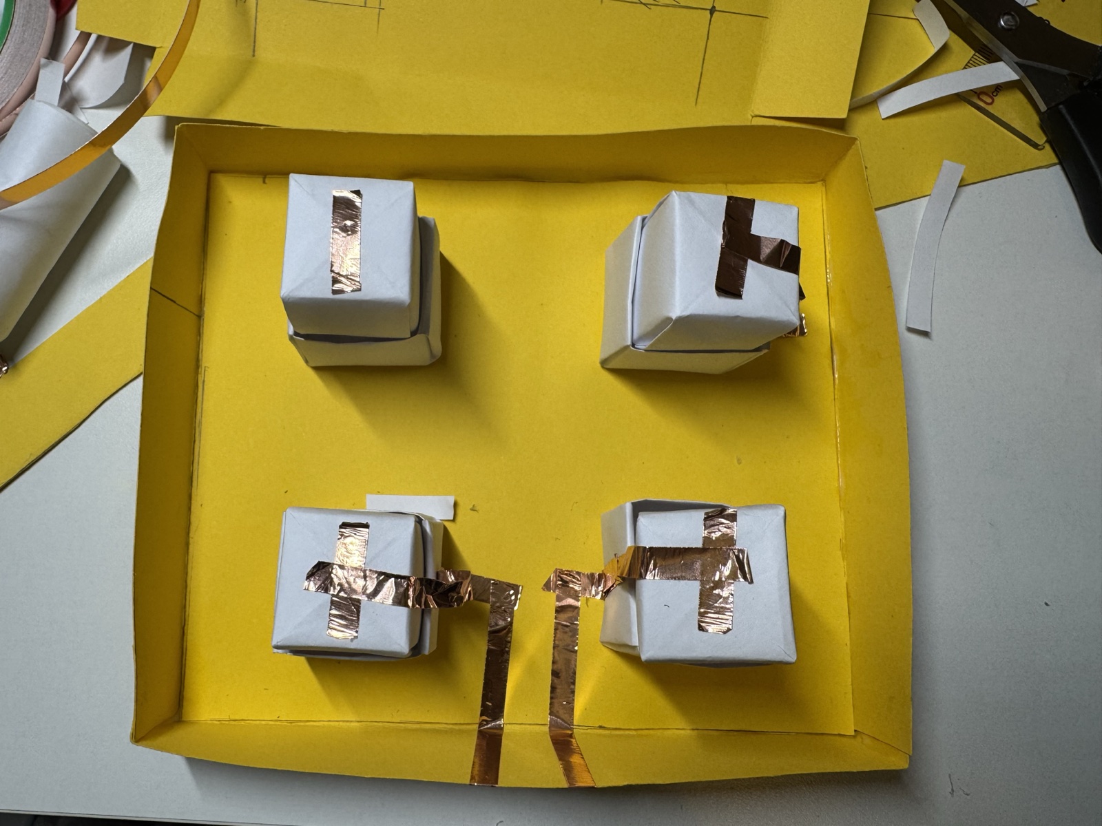I started adding conductive tape to each button so they could connect to Makey Makey.